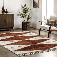 Load image into Gallery viewer, Living room with a patterned rug, wooden cabinet, and armchair.