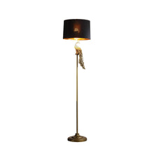 Load image into Gallery viewer, Floor lamp with black shade and decorative elements on a white background