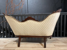 Load image into Gallery viewer, Vintage-style chair with beige patterned fabric and wooden frame on a wooden floor.