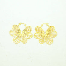 Load image into Gallery viewer, Gold flower-shaped earrings on a white background