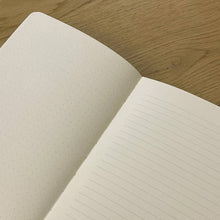 Load image into Gallery viewer, Open notebook with lined and dotted pages on a wooden surface