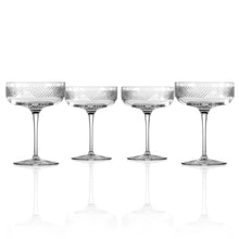 Load image into Gallery viewer, Set of four clear glass cocktail coupes with textured design on a white background