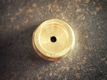 Load image into Gallery viewer, Brass metal object on a textured brown surface