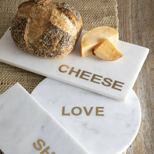 Load image into Gallery viewer, Marble cutting boards with 'CHEESE', 'LOVE', and 'SH' engraved on them, accompanied by bread and cheese.