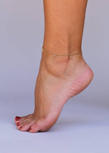 Load image into Gallery viewer, Gold anklet on a foot against a plain background