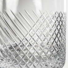 Load image into Gallery viewer, Close-up of a crystal glass with diamond cut pattern