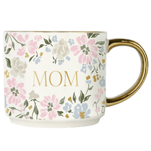Load image into Gallery viewer, Floral mug with 'MOM' printed on it, with a gold handle.