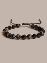 Load image into Gallery viewer, Black beaded bracelet on a beige background