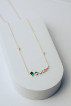Load image into Gallery viewer, Necklace with colorful gemstones on a white stand