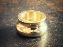 Load image into Gallery viewer, Gold cone incense holder on a textured brown surface