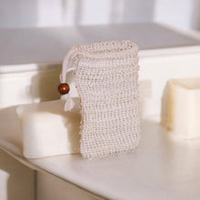Load image into Gallery viewer, Mesh soap bag with a wooden bead on a white surface
