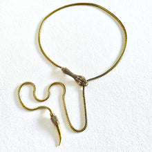Load image into Gallery viewer, Solid brass serpant lariat necklace on a white textured background