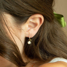 Load image into Gallery viewer, woman wearing a small hoop earring with a pearl charm