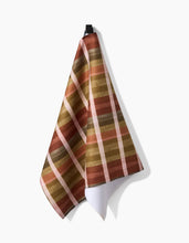 Load image into Gallery viewer, Plaid towel with brown, beige, and red stripes on a white background