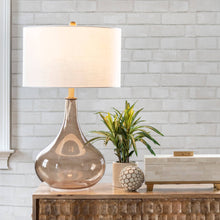 Load image into Gallery viewer, Decorative lamp with a white shade on a wooden console table against a light gray brick wall.
