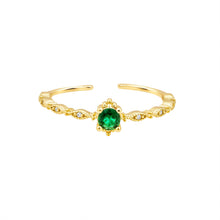 Load image into Gallery viewer, Gold ring with a green gemstone on a white background