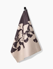Load image into Gallery viewer, Floral patterned towel hanging on a hook with a white background