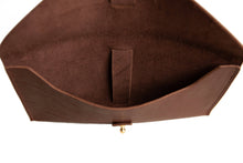 Load image into Gallery viewer, Brown leather clutch bag with gold clasp on a white background