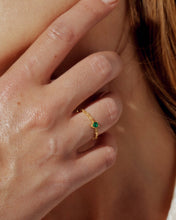Load image into Gallery viewer, Close-up of a hand wearing a gold ring with a green gemstone.
