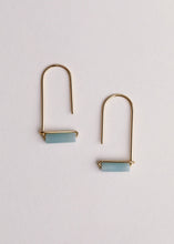 Load image into Gallery viewer, Gold earrings with light blue stones on a white background