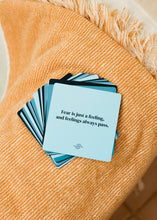 Load image into Gallery viewer, Stack of cards with a motivational quote on an orange textured surface