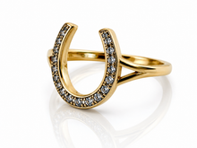 Load image into Gallery viewer, Gold ring shaped like a horseshoe with embedded stones on a white background