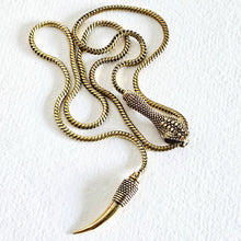 Load image into Gallery viewer, Solid brass serpant lariat necklace on a white textured background
