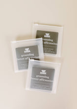 Load image into Gallery viewer, Shower affirmation cards with affirmations for the bath and shower focused on grounding shown in clear plastic zip closure packaging
