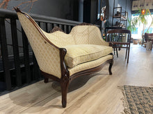 Load image into Gallery viewer, Vintage-style sofa with wooden frame in a room setting