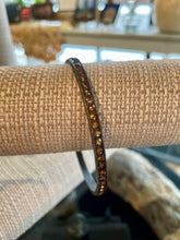 Load image into Gallery viewer, Bracelet with brown stones on a beige surface