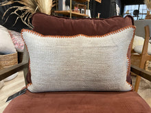 Load image into Gallery viewer, Textured beige pillow on a chair with a blurred indoor setting in the background.