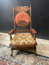 Load image into Gallery viewer, Wooden chair with floral cushion on a patterned rug