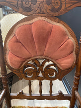 Load image into Gallery viewer, Wooden chair with a pink cushion on a blurred background