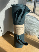 Load image into Gallery viewer, green scarf with a label on a wooden surface