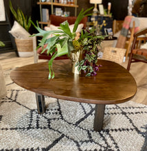 Load image into Gallery viewer, Wooden coffee table with decorative plants on a patterned rug in a living room setting.