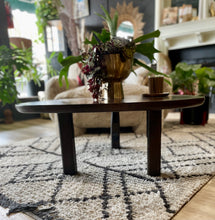 Load image into Gallery viewer, Wooden coffee table with decorative items in a living room setting