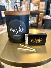 Load image into Gallery viewer, Mishi candle and matches on a table with a blurred background