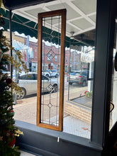 Load image into Gallery viewer, Decorative glass panel in a store window with a Christmas tree on the left.