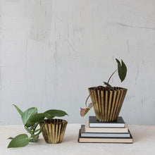 Load image into Gallery viewer, Two decorative planters with a plant on top of books against a light gray background