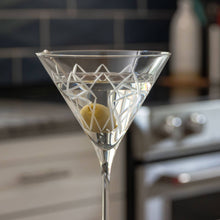 Load image into Gallery viewer, Martini glass with a olive on a blurred kitchen background