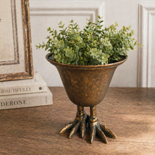 Load image into Gallery viewer, Decorative plant holder with green leaves on a wooden surface