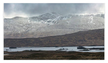 Load image into Gallery viewer, Scenic view of a mountain range with snow-capped peaks and a lake in the foreground.