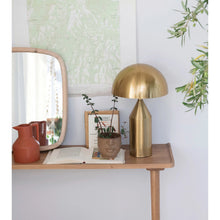 Load image into Gallery viewer, Gold metal retro design table lamp sitting on a console table with a mirrir and planter