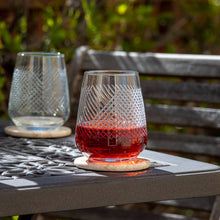 Load image into Gallery viewer, Two glass tumblers with red liquid on a metal table outdoors.