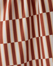 Load image into Gallery viewer, A close-up of a fabric pattern featuring alternating vertical stripes in terracotta red and off-white, separated by thin gold lines.