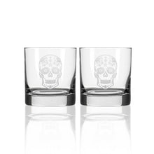 Load image into Gallery viewer, Two clear glass tumblers with sugar skull designs on a white background