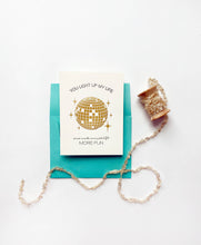 Load image into Gallery viewer, Card with disco ball design and decorative elements on a white background