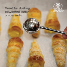 Load image into Gallery viewer, Silver ice cream scoop being used to dust powdered sugar on pastries with Fox Run Brands logo.