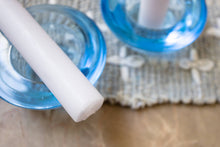 Load image into Gallery viewer, Close-up of the base of a taper candle with a candle holder