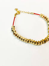Load image into Gallery viewer, Gold beaded bracelet on a white background